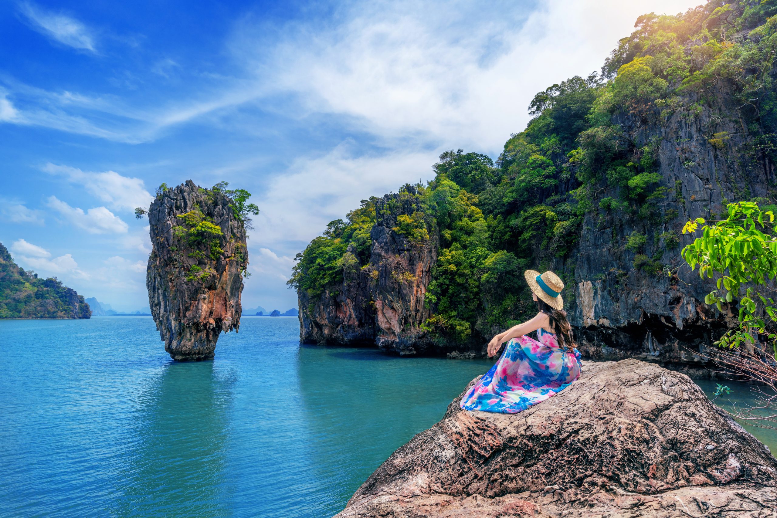 beautiful girl sitting rock james bond island phang nga thailand scaled